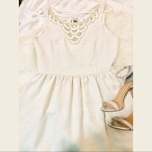 Beaded white cocktail dress with silver details